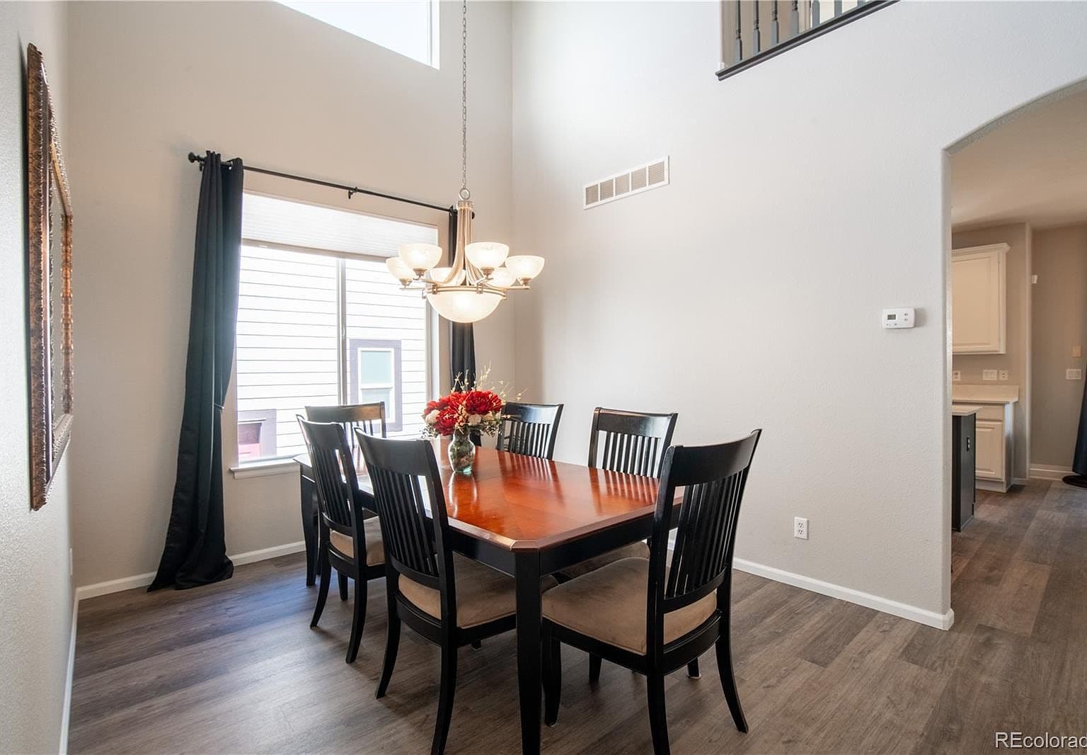 Spacious dining area flows seamlessly to the kitchen.