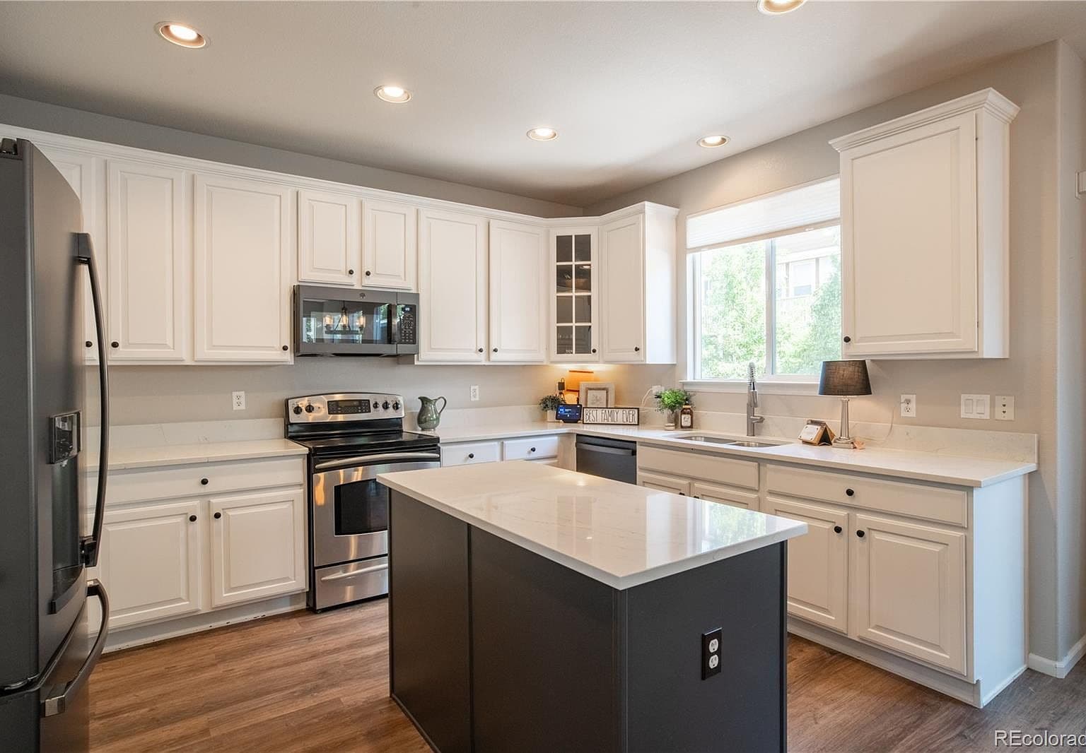 Updated kitchen with quartz counters and oversized island.