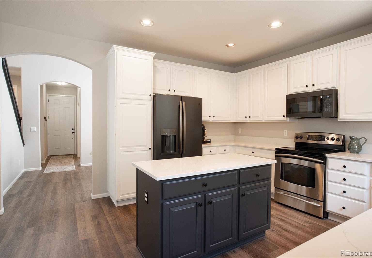 Bright, modern kitchen with newer stainless appliances.