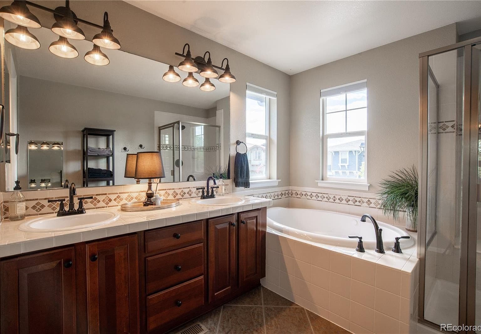 Spa-inspired primary bath with soaking tub and double vanity.