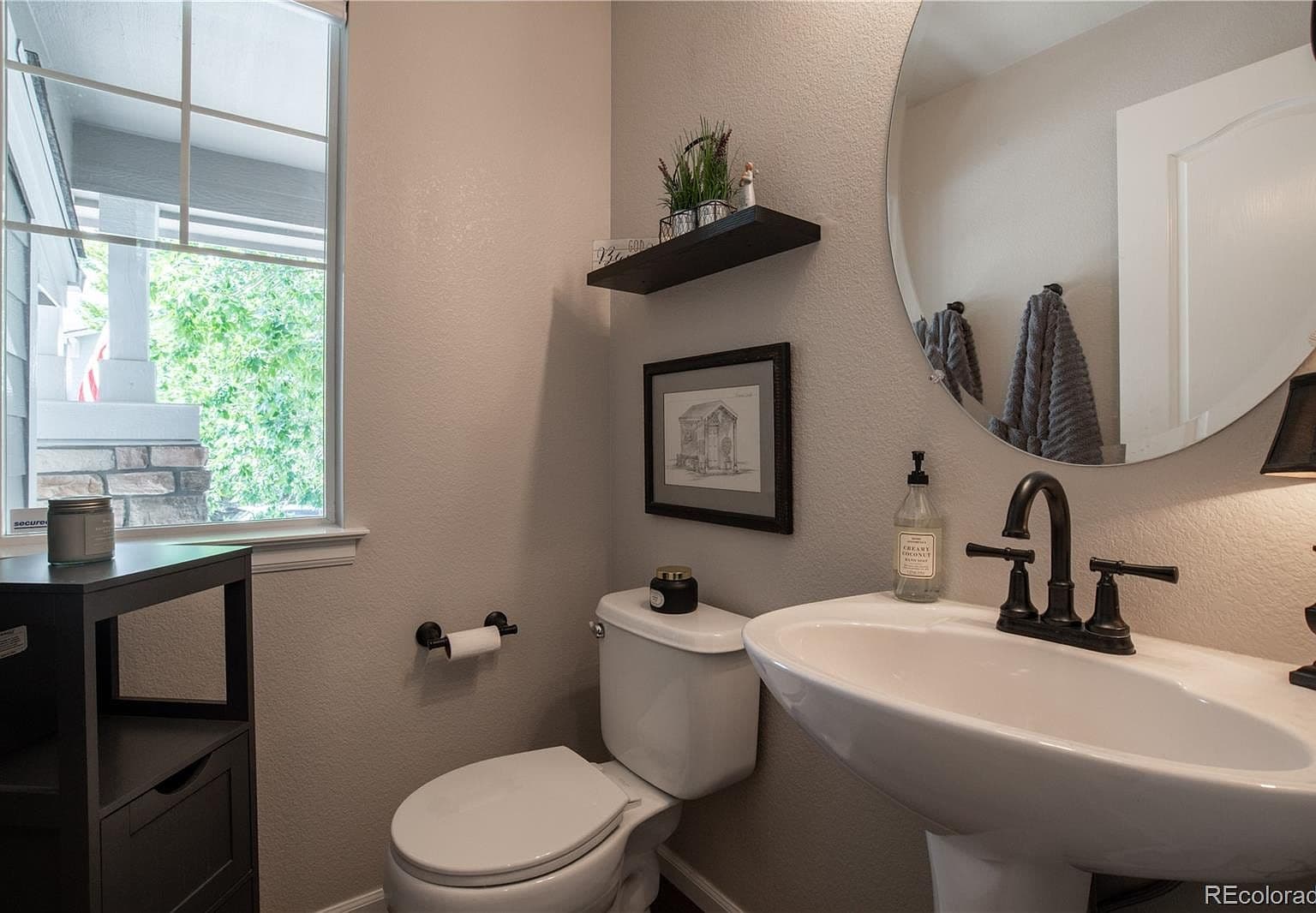 Stylish main-level powder bath with modern fixtures.