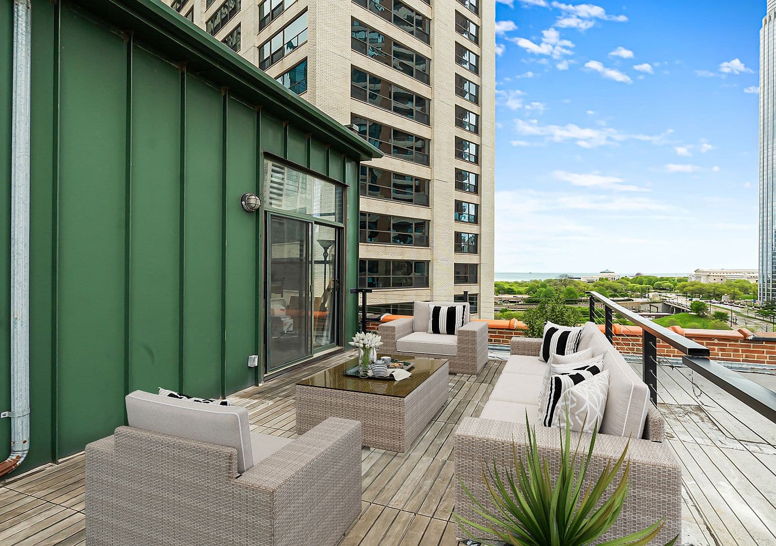 Private rooftop deck with lounge seating and lake views