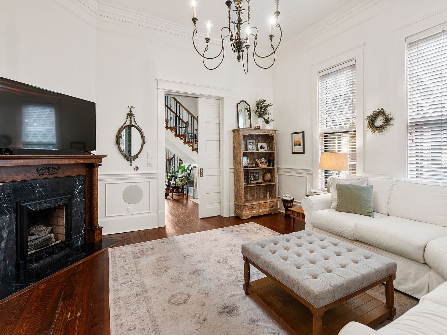 Cozy sitting room showcasing second original marble fireplace.