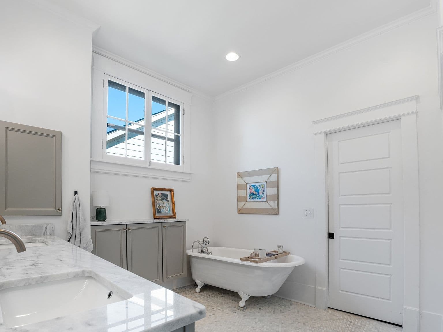 Oversized walk-in shower and marble-topped vanity, beautifully renovated.