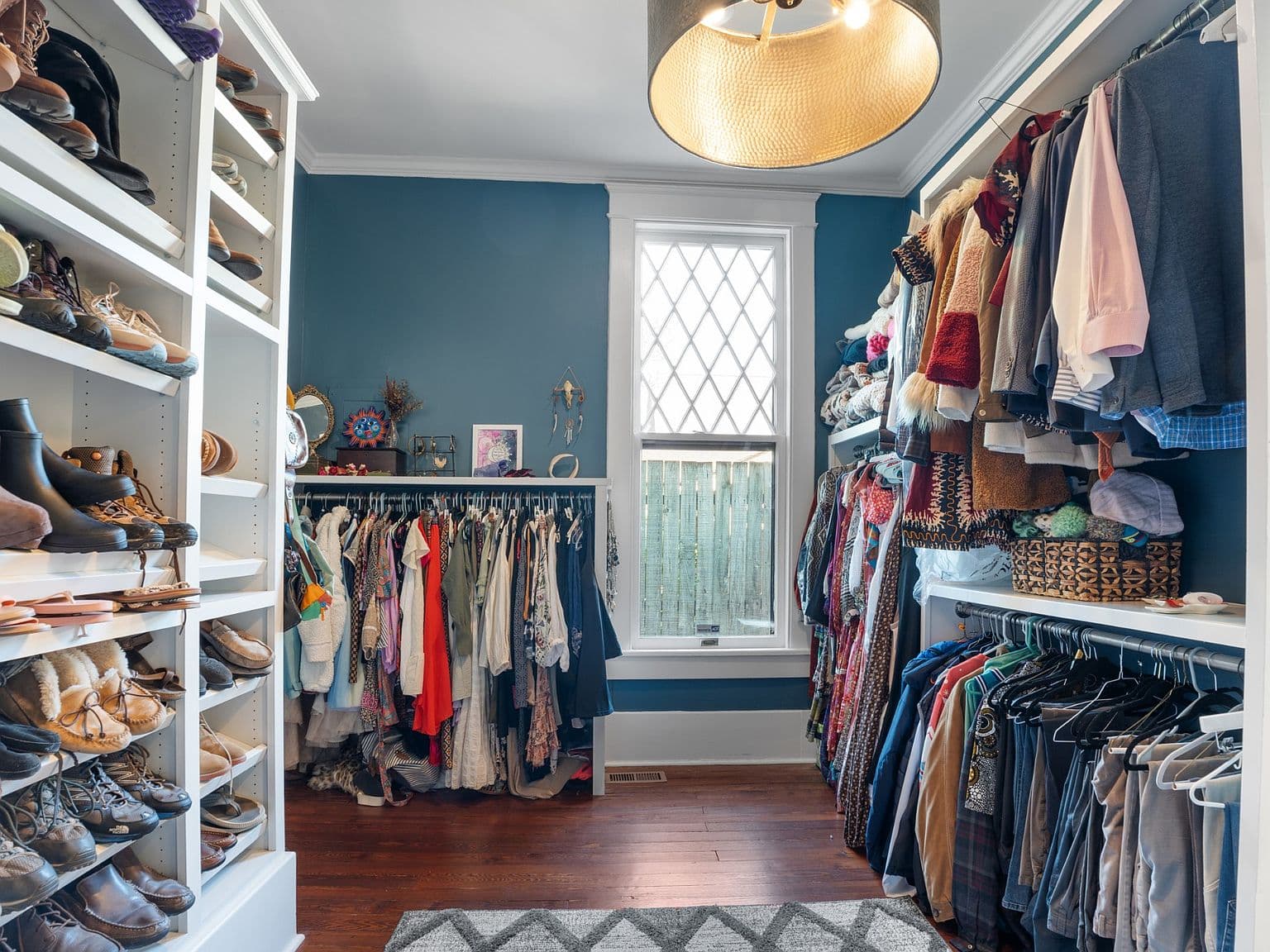 Spacious custom closet with double hanging and shelves.