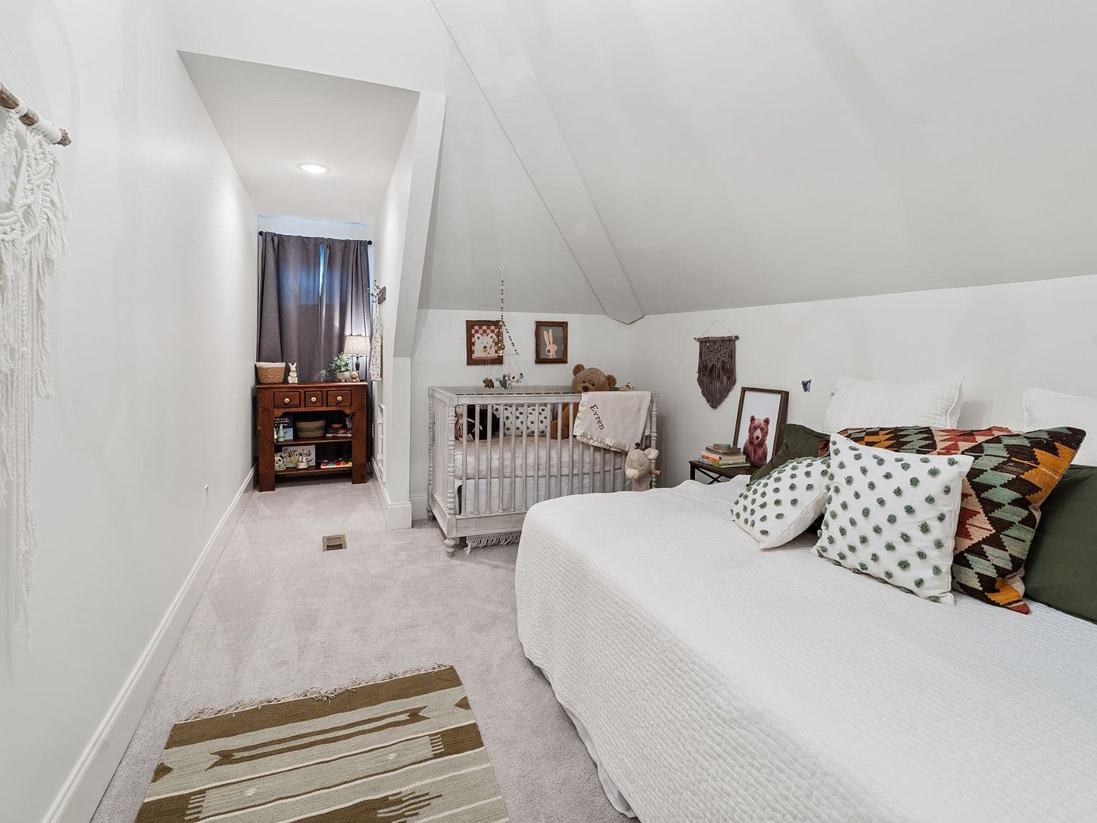 Versatile upper-level room perfect for nursery or guest suite.