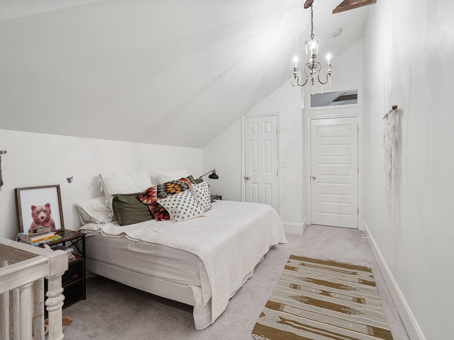 Airy upstairs bedroom with private hall and closet access.