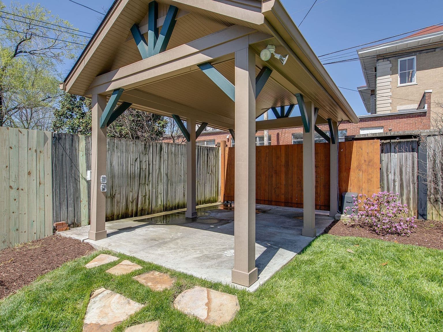Covered one-car carport offers secure, convenient parking.