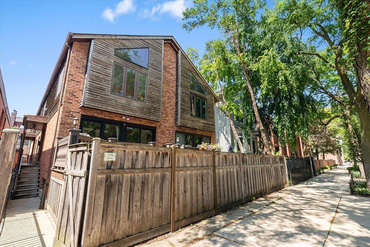 Architectural Chicago townhome with private, fenced outdoor living.