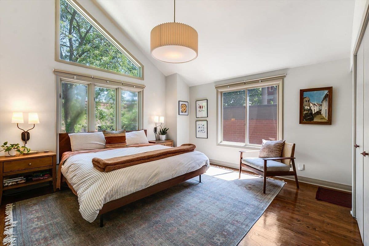 Light-filled bedroom with soaring ceilings and peaceful outlooks.