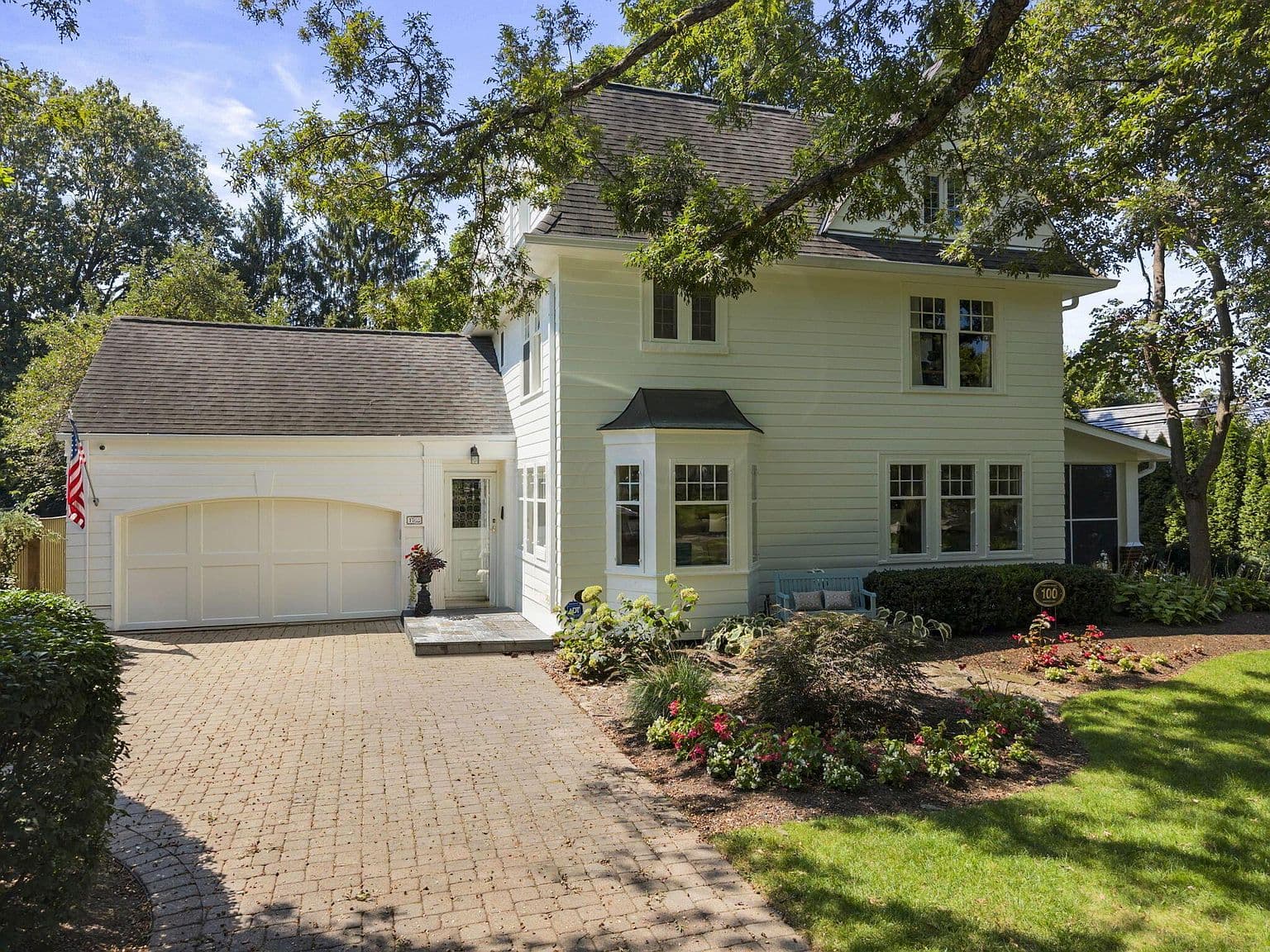 Classic Upper Arlington charm with attached two-car garage.