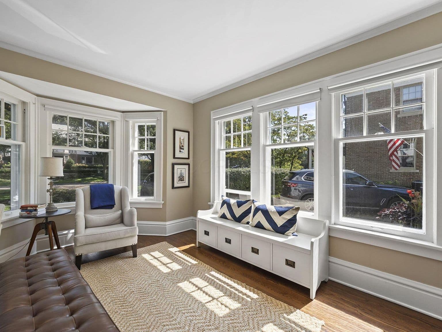 Spacious family room anchored by a cozy wood-burning fireplace.