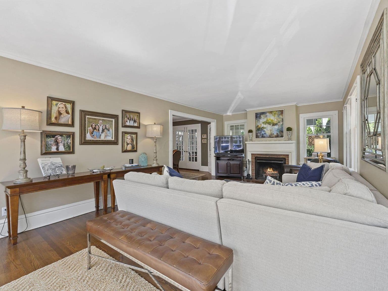 Cozy family room with decorative fireplace and warm floors.
