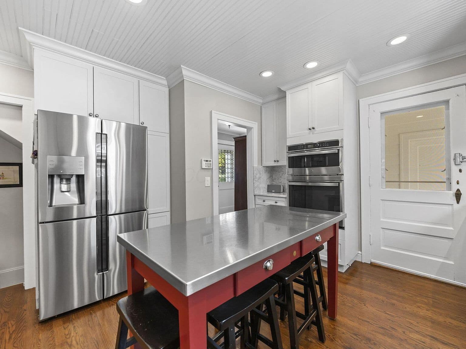 Entertain-ready kitchen island with seating and modern lighting.