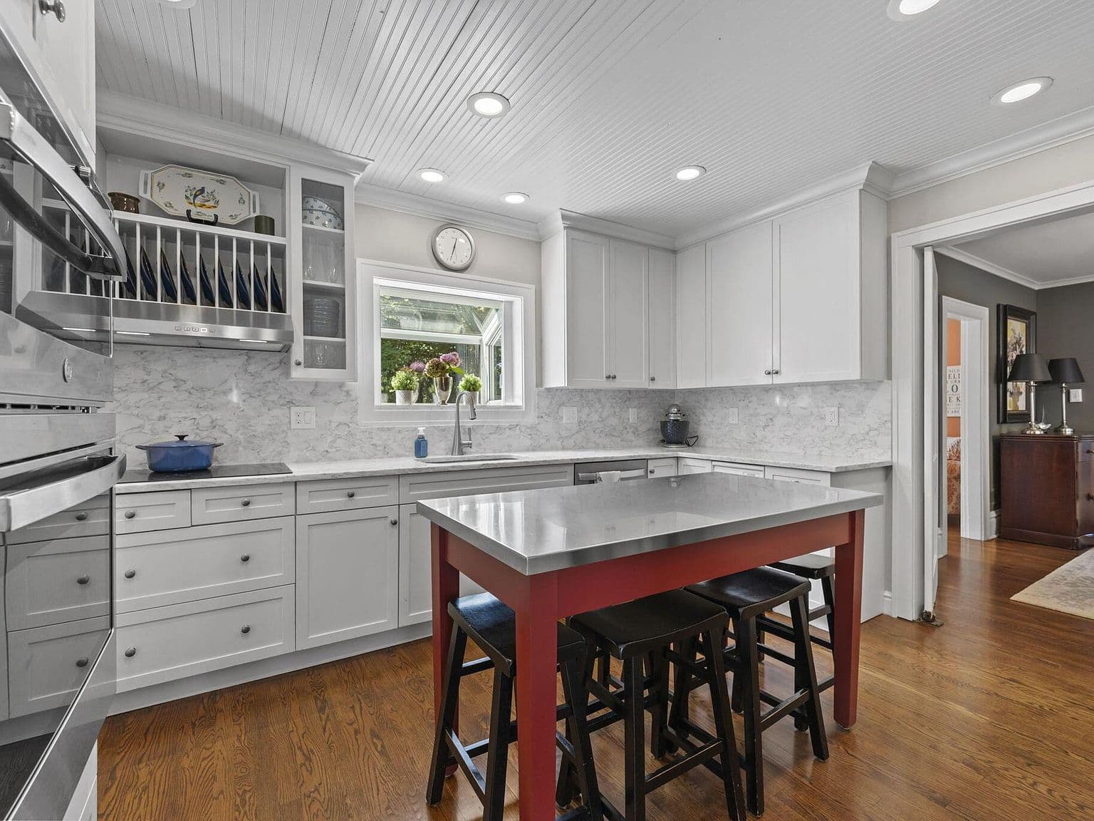 Stylish kitchen with marble backsplash and generous workspace.