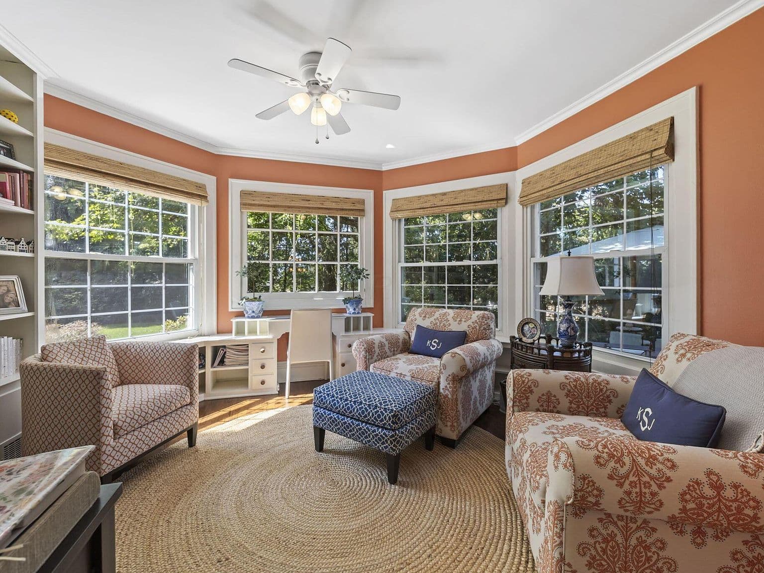 Sunlit den with built-ins and peaceful window seats.