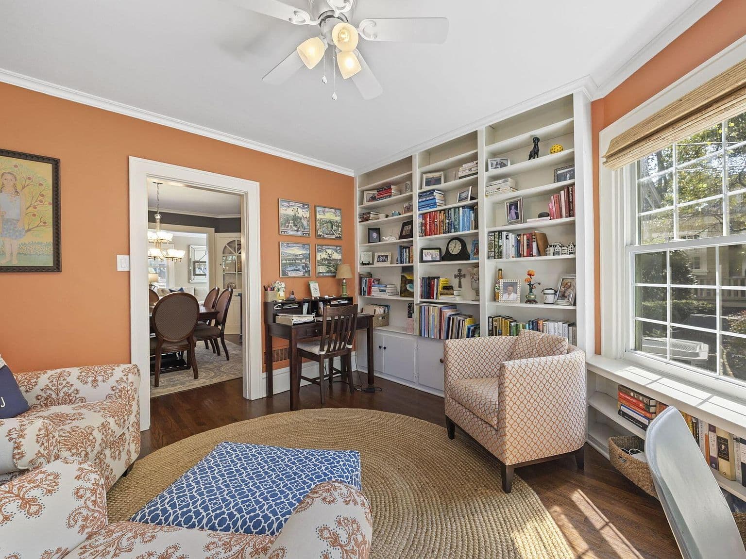 Cozy reading nook and workspace in charming den.