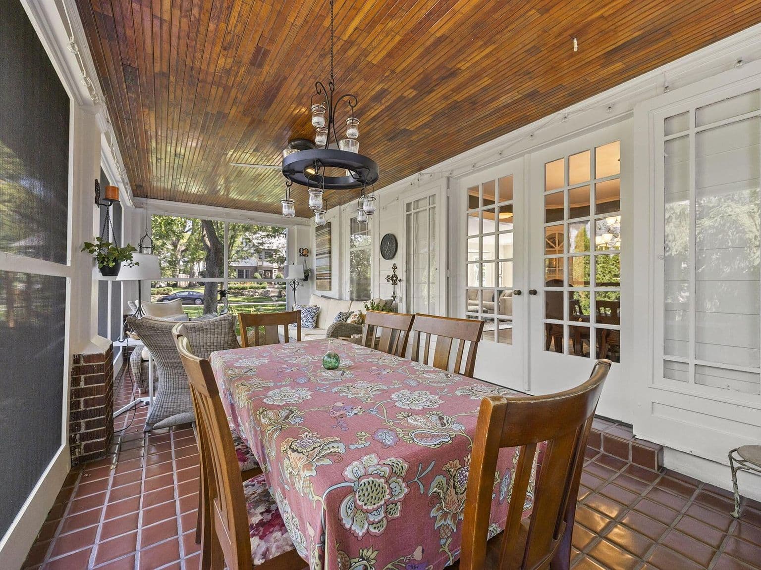 French doors open to expansive screened porch entertaining.