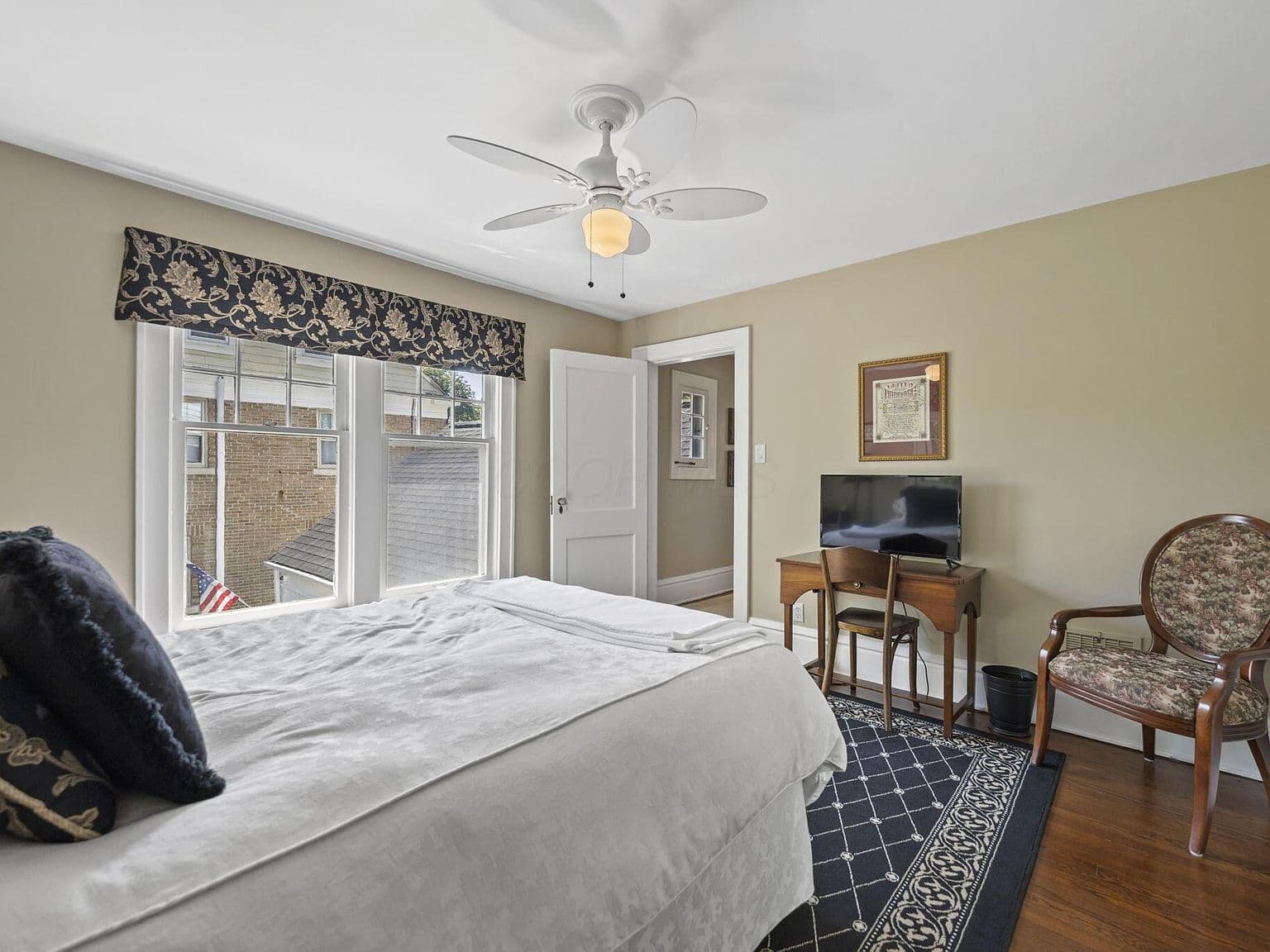 Cozy bedroom with classic trim and desk nook.