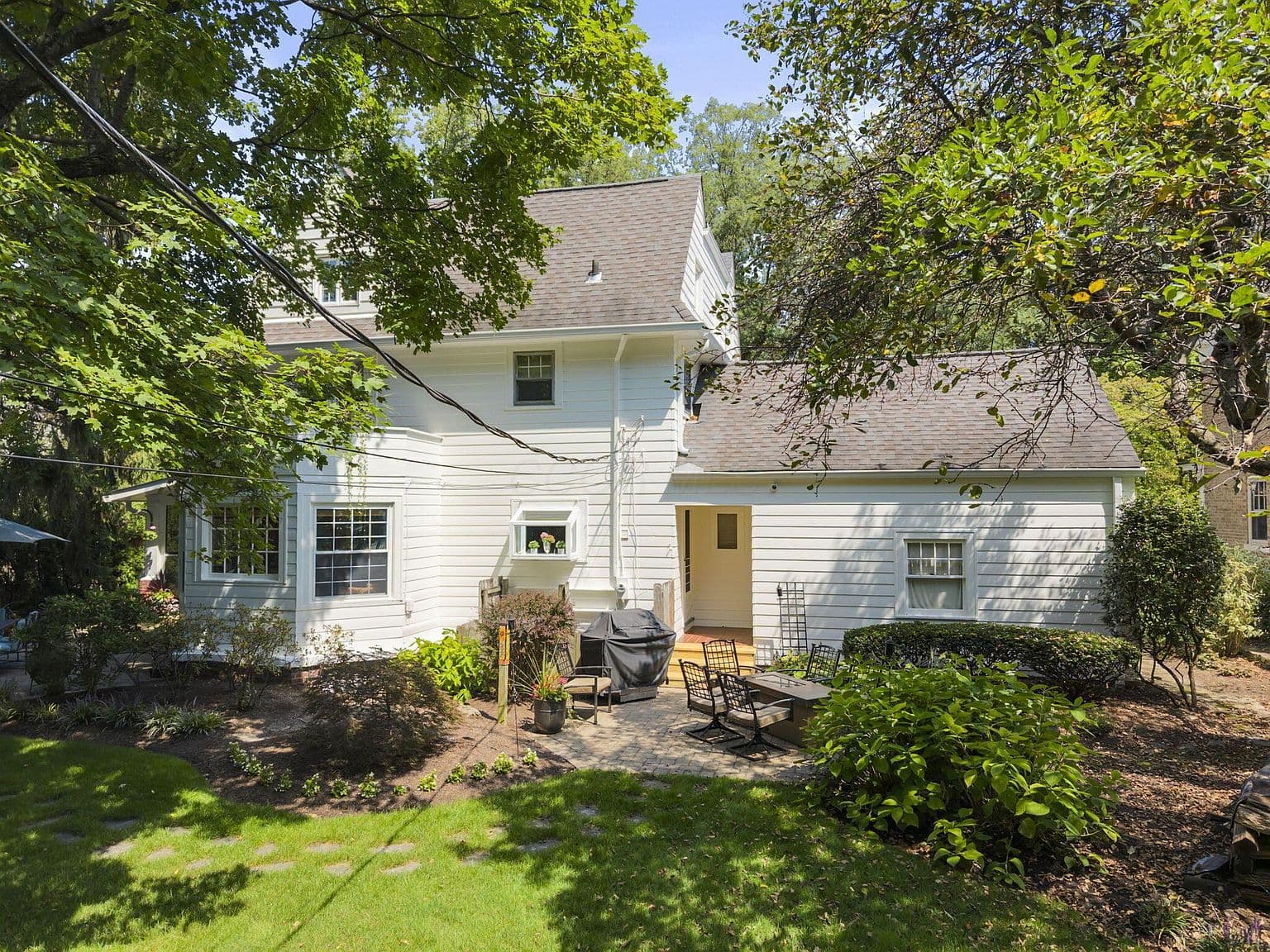 Cozy outdoor seating and grilling patio off the home.