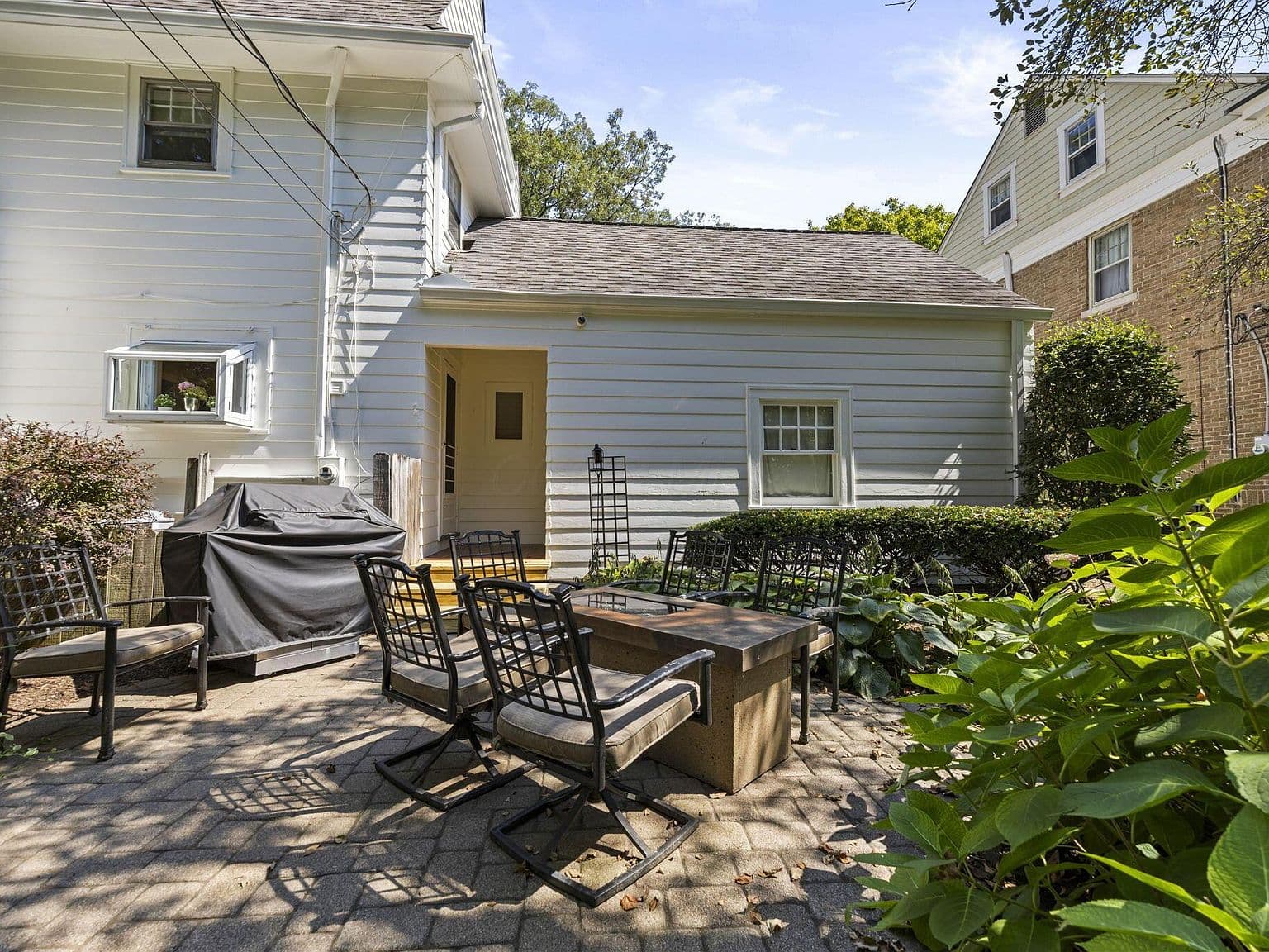 Cozy patio lounge area for grilling and gatherings.