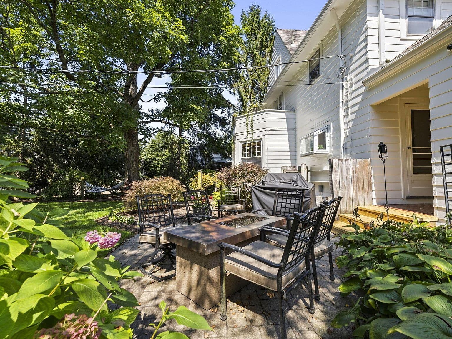 Paver patio seating with garden views and easy access.
