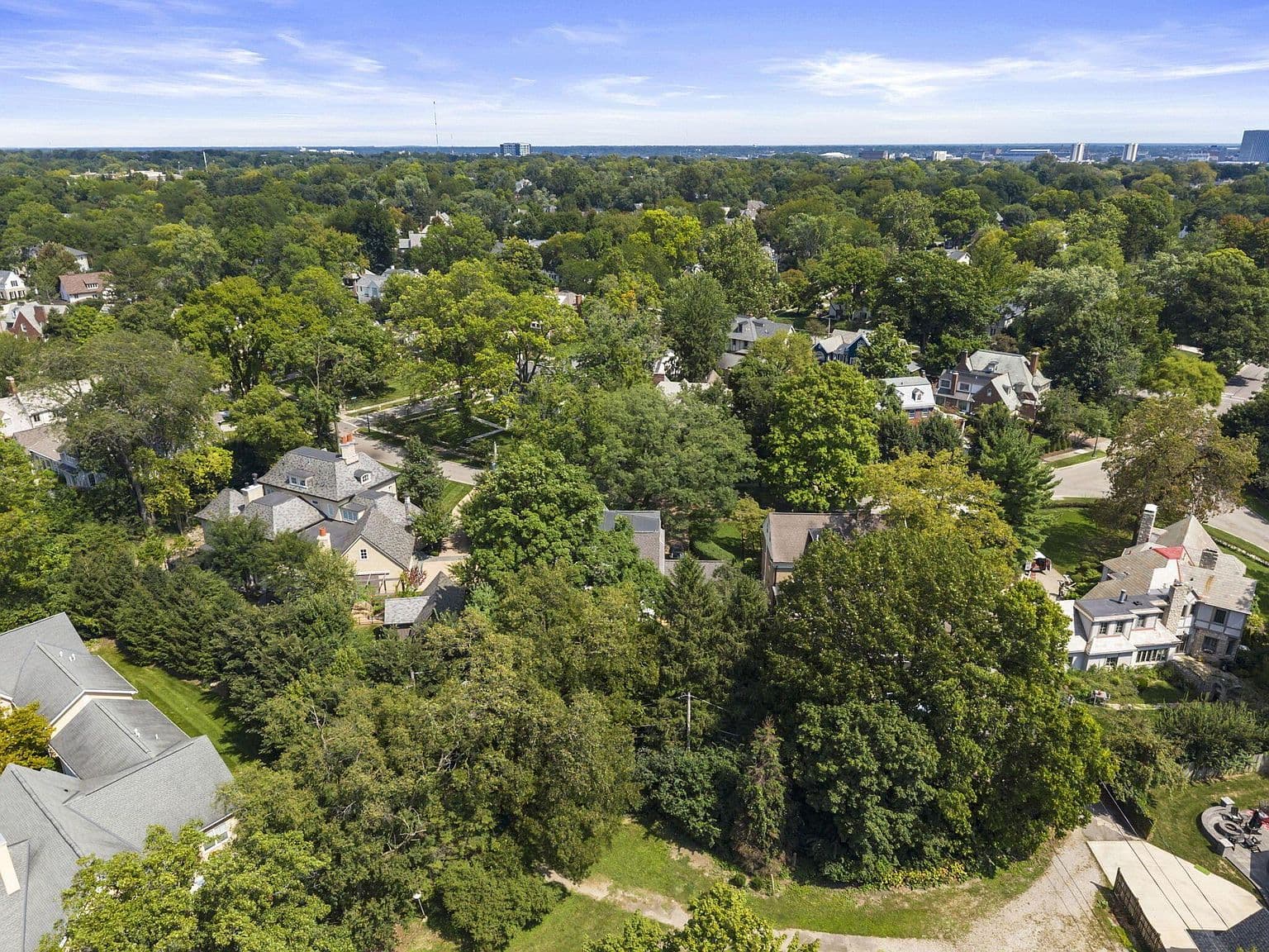Bird’s-eye perspective highlights quiet streets and mature trees.