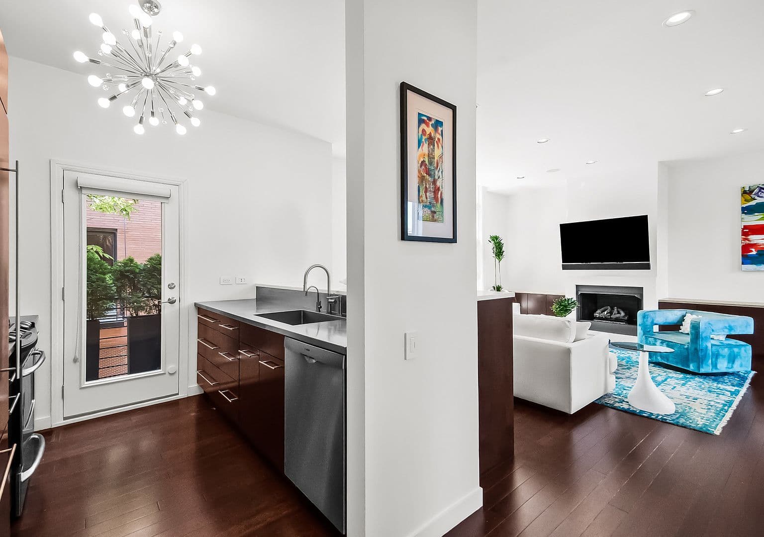 Kitchen flows to living area and private balcony access.