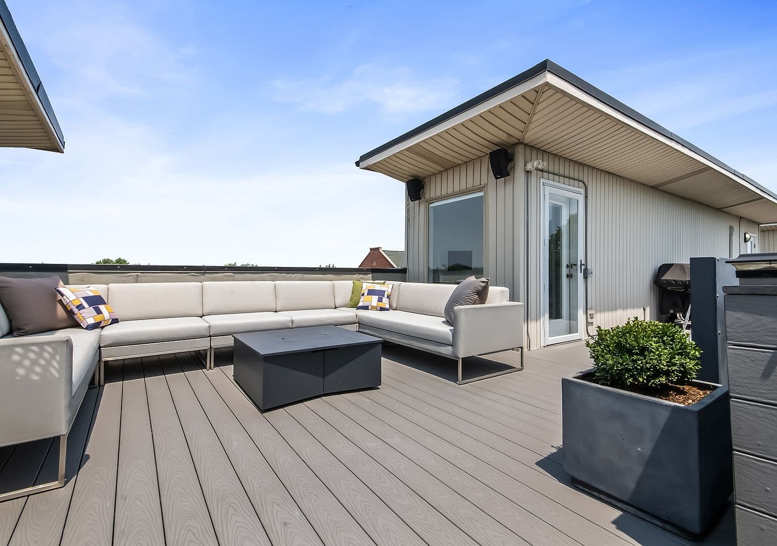 Lounge-ready rooftop terrace with grill station and skyline breezes.