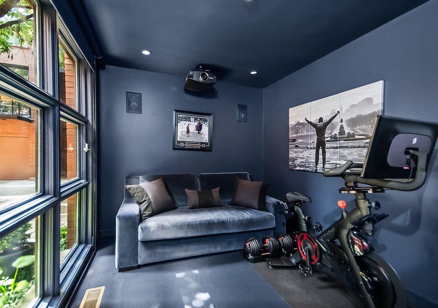 First-floor media room or gym with projector setup.