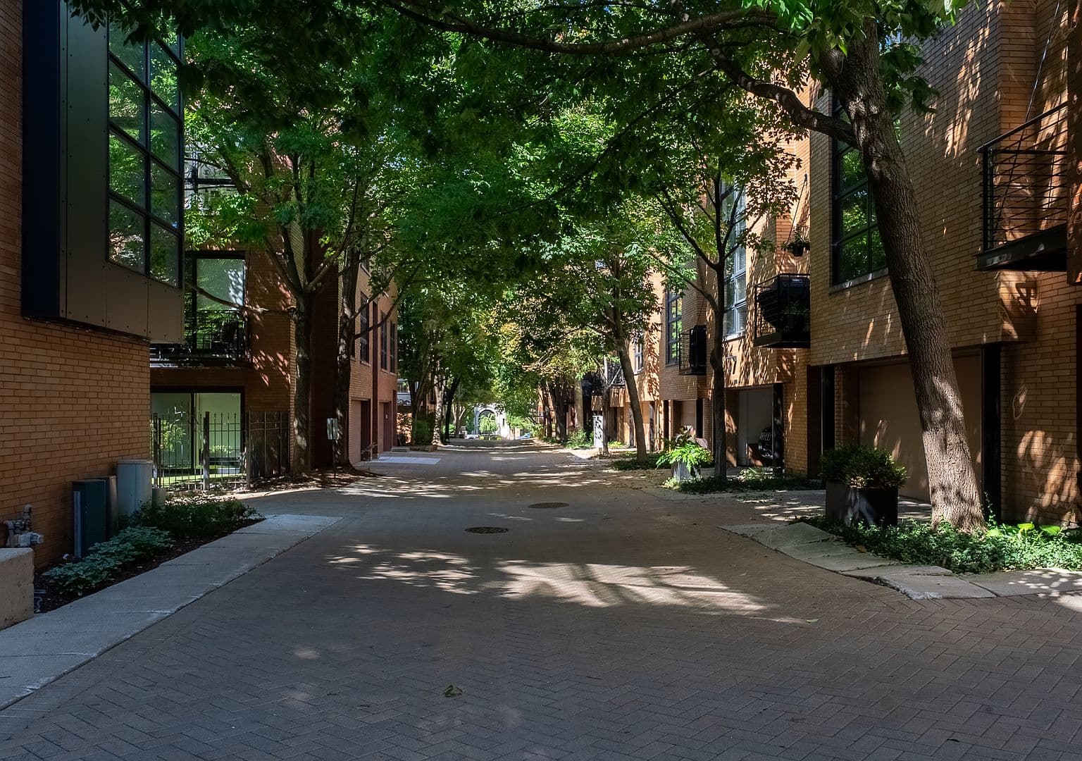 Quiet, tree-lined private drive in boutique townhome community.