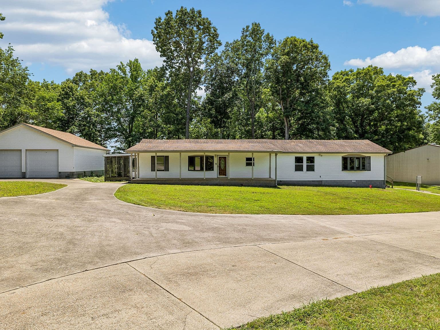 Spacious ranch with workshop and detached garage.