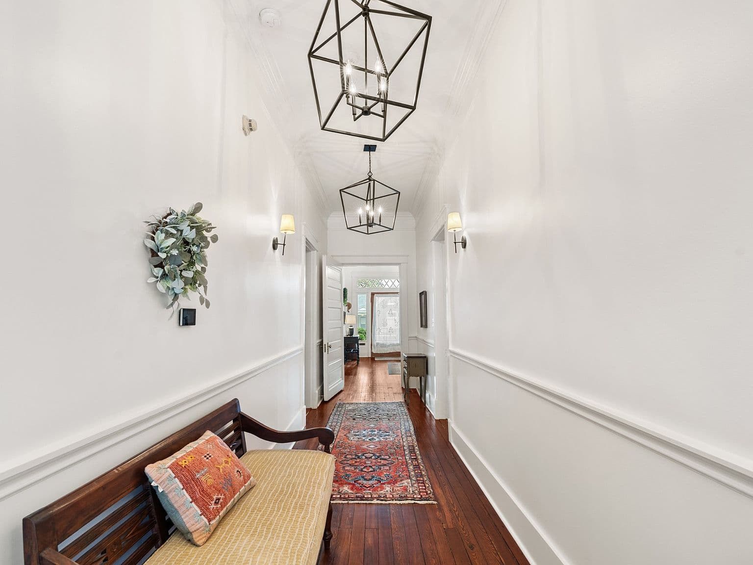 Gallery-style corridor connecting main-level rooms with ease.