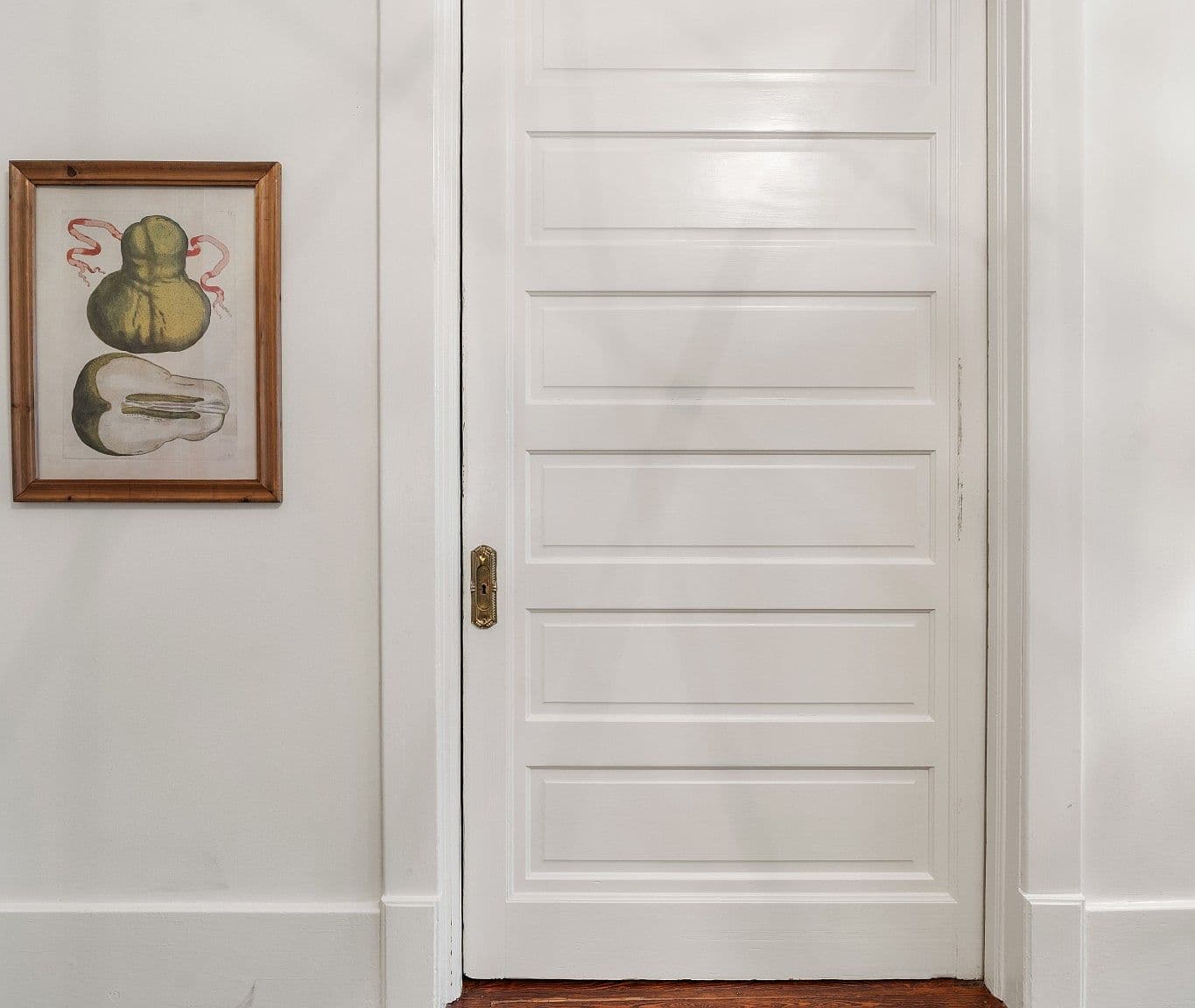 Classic paneled door detail adds vintage character throughout.