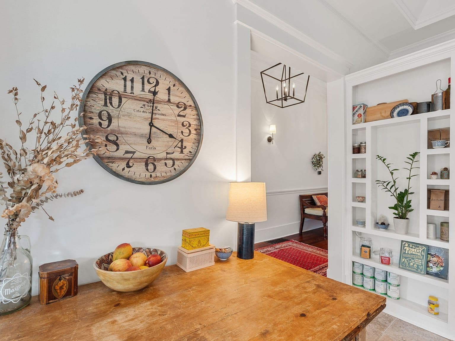 Charming dining nook with built-in shelving and vintage details.