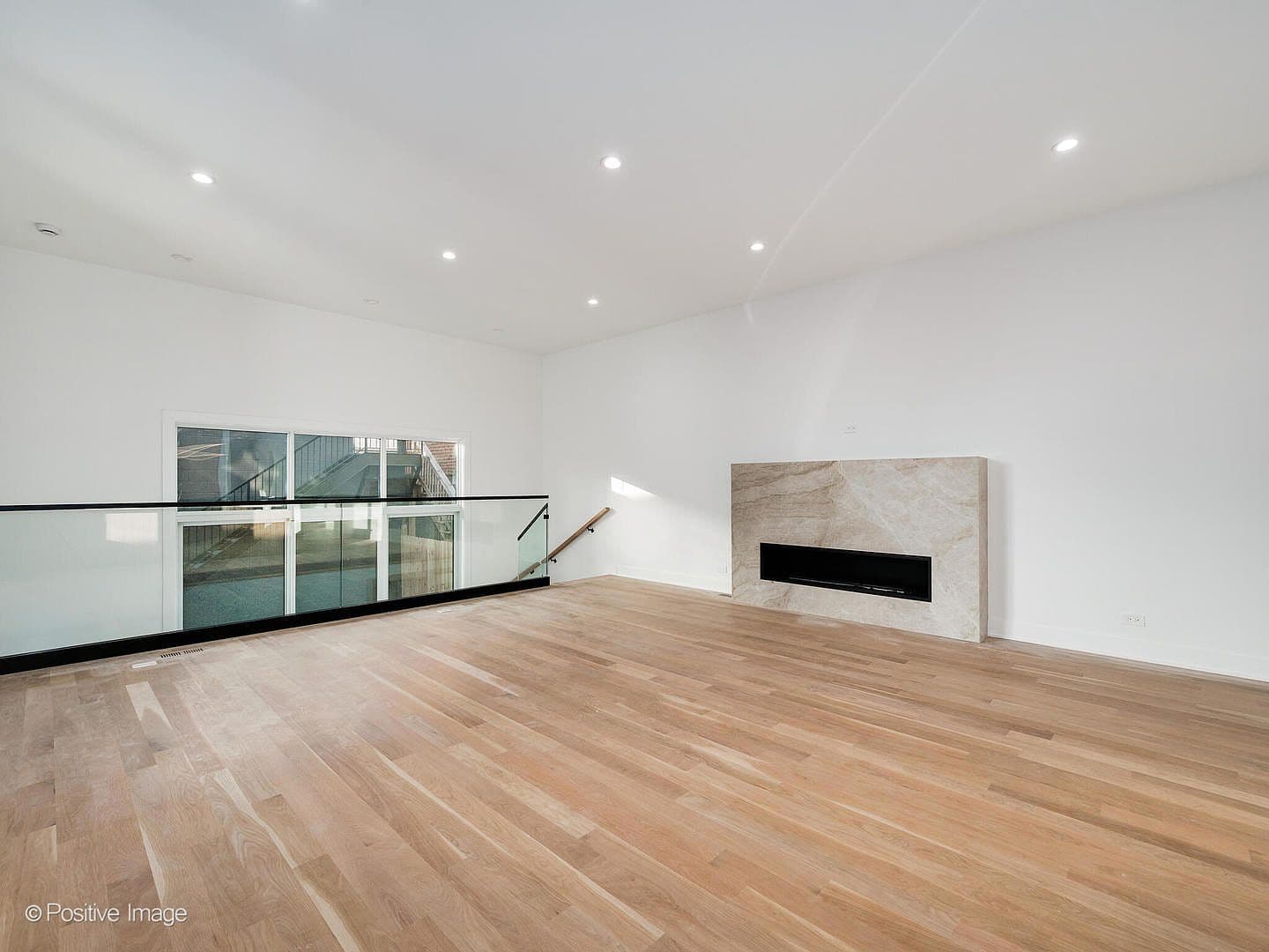Family room with dramatic quartzite fireplace surround
