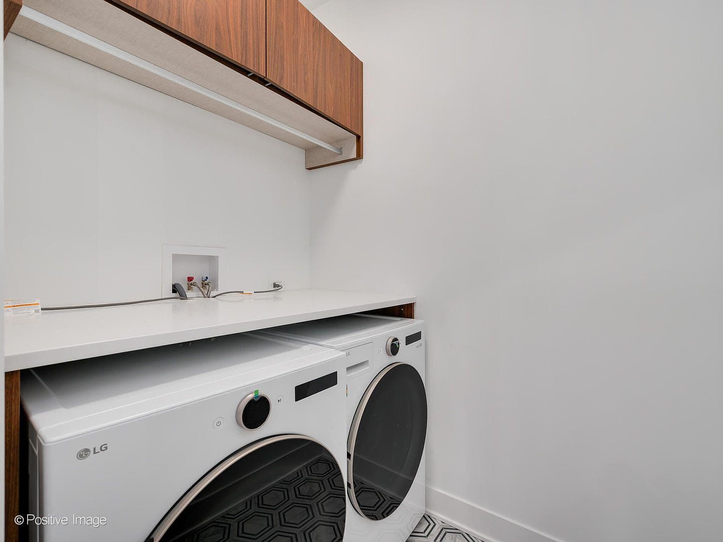 Dedicated laundry room with LG washer and dryer