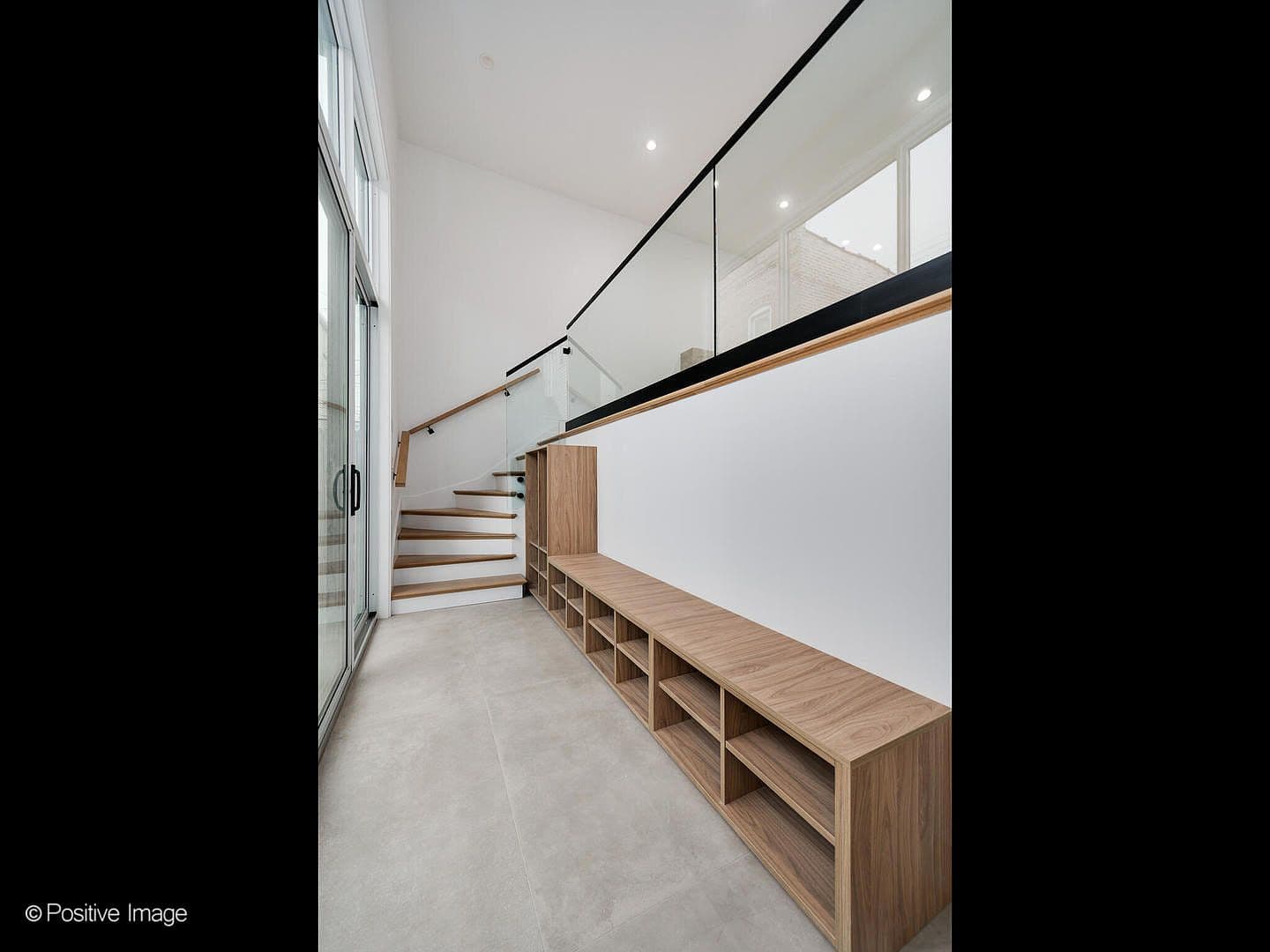 Mudroom entry with built-in bench and cubby storage