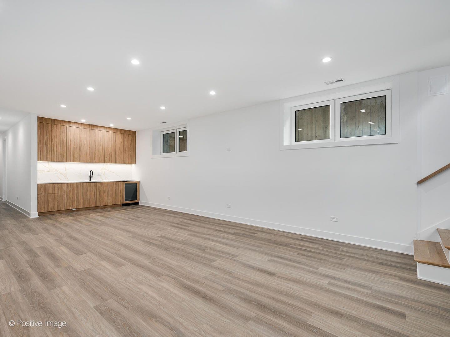 Lower-level rec room with walnut wet bar