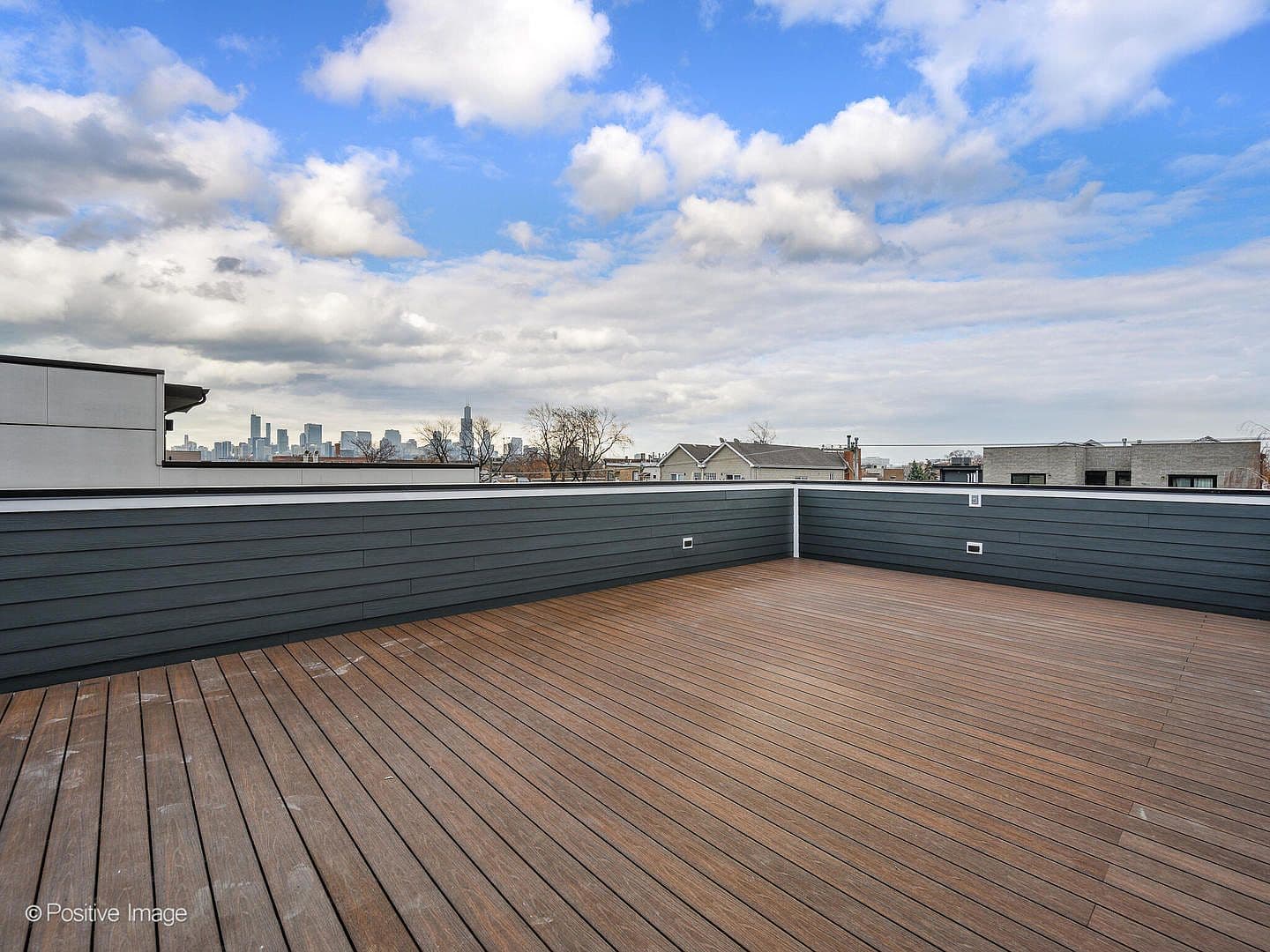 Massive rooftop deck with sweeping Chicago skyline views