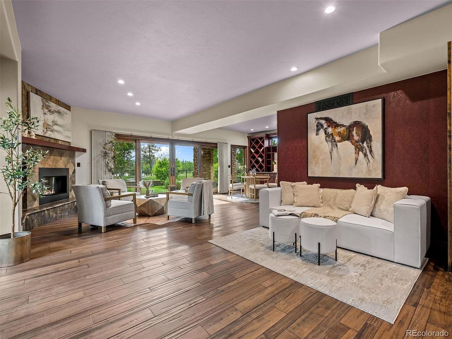 Spacious living area opens to the green backyard