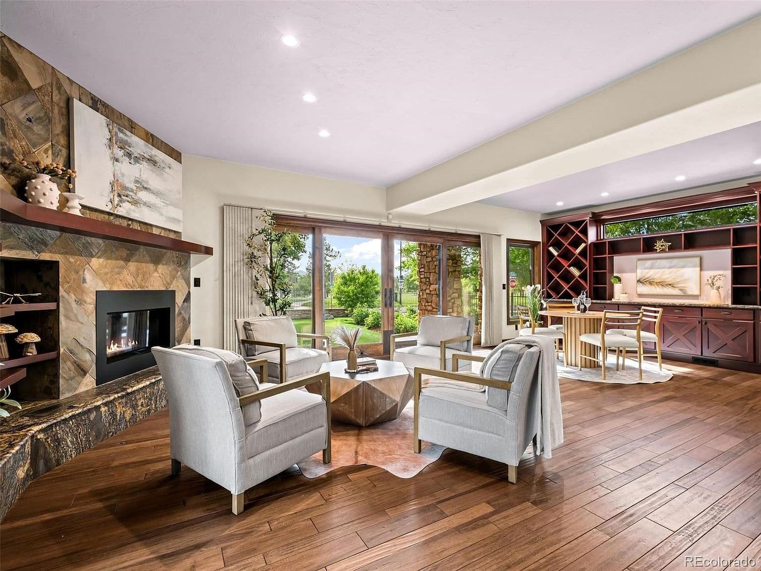 Fireside seating and glass doors invite indoor-outdoor living
