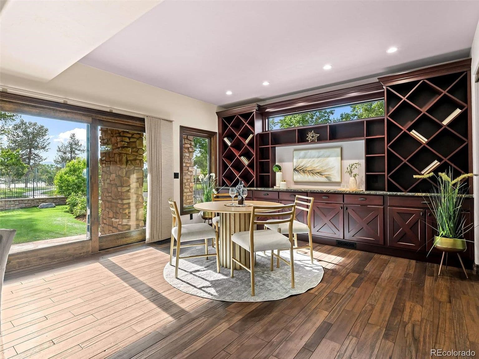 Bright dining area opens to the lawn and patio
