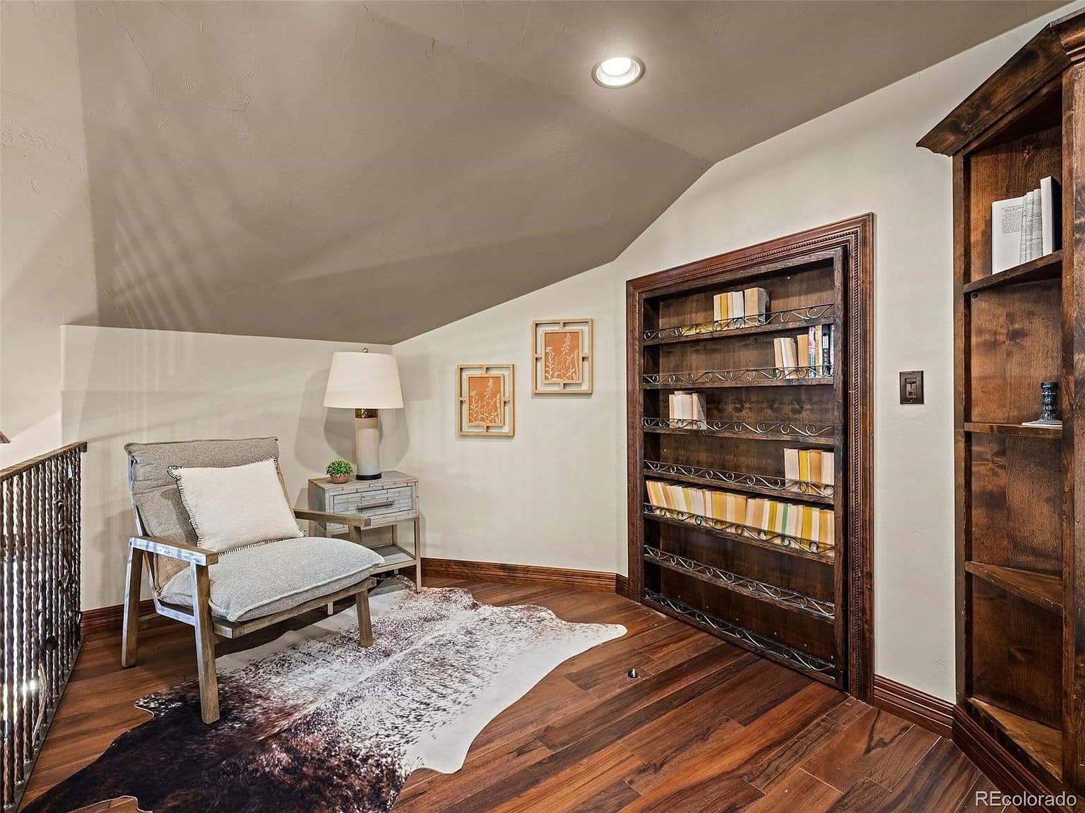 Settle into the inviting reading nook beside built-in shelves.