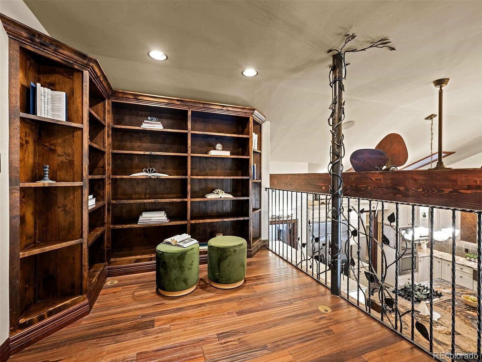 An upstairs library overlooks the home’s main level.