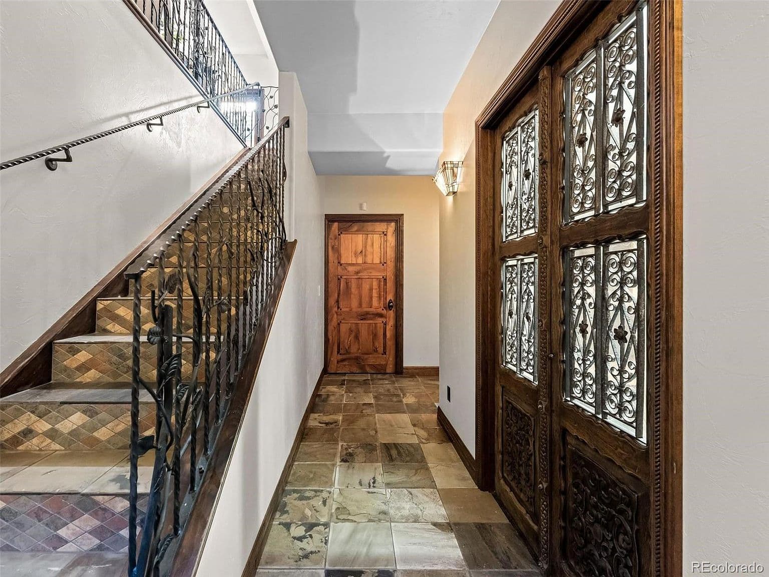 Ornate double doors and ironwork welcome you home.