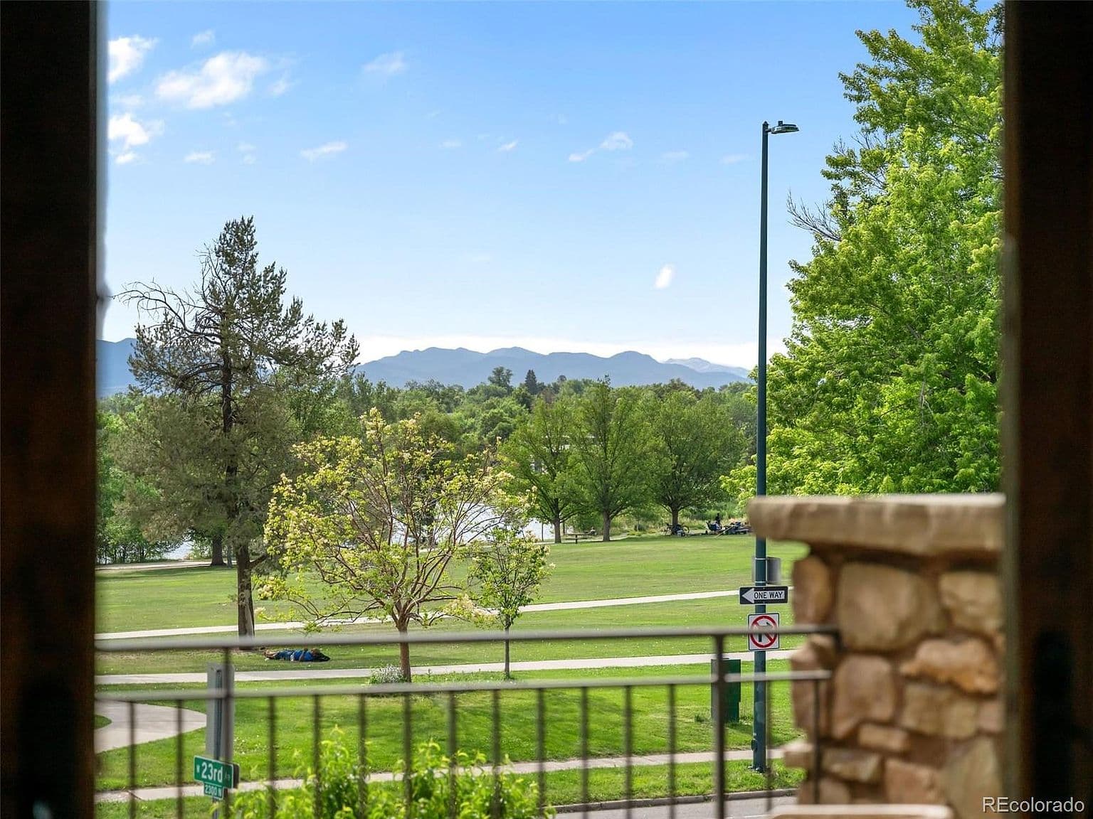 Mountain views rise beyond the lakeside park