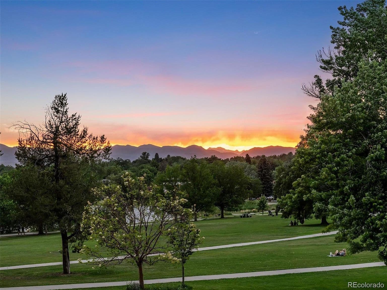 Sunset lights up the mountains beyond the park