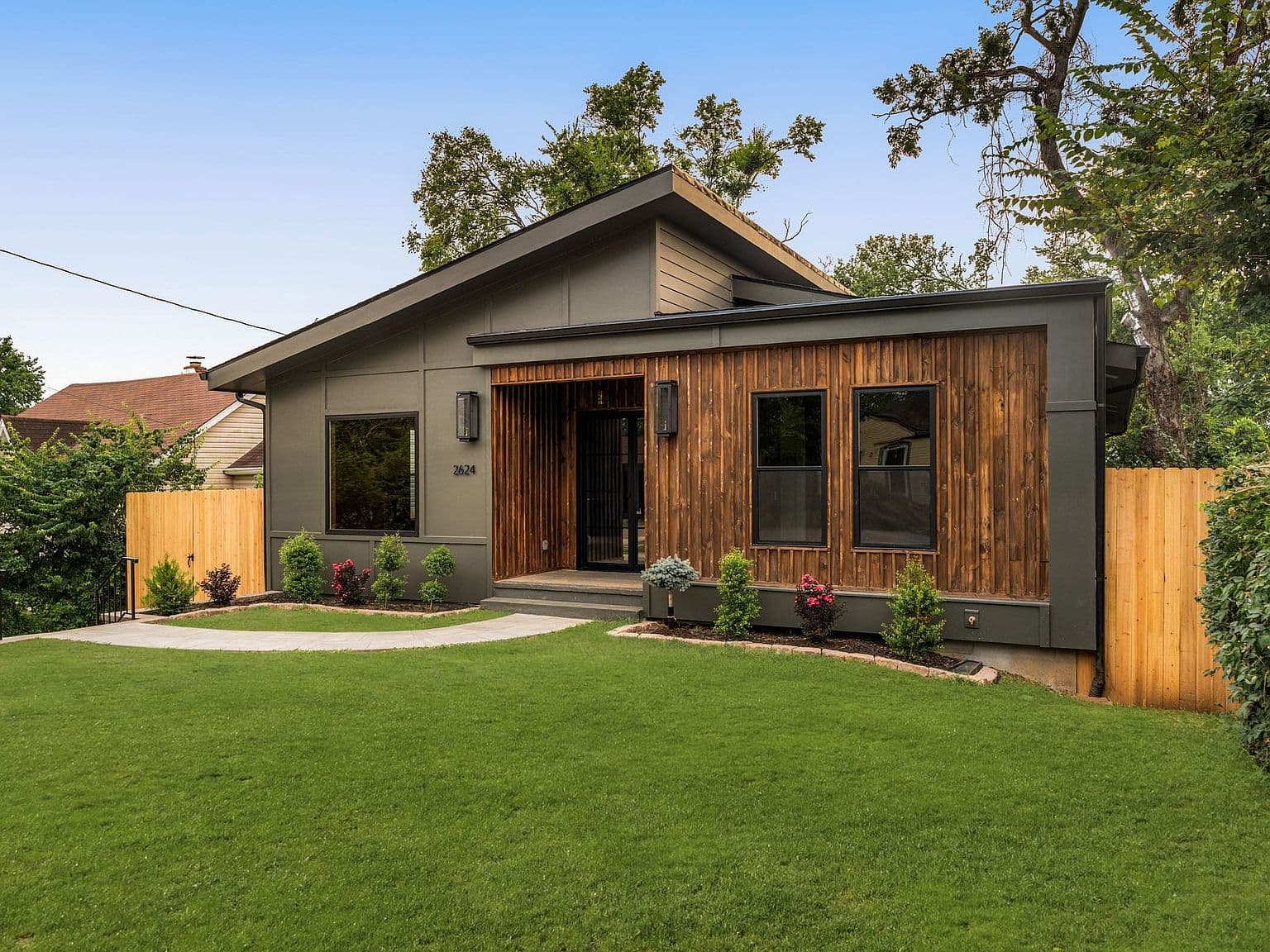 Fresh landscaping and sleek exterior lines welcome you home.