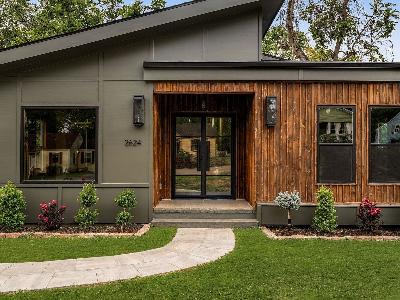 Solid iron double doors make an unforgettable entry.